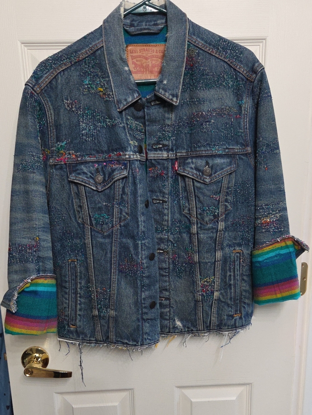 Levi's Blue Distressed Denim Jacket with Colorful Cuff Detail